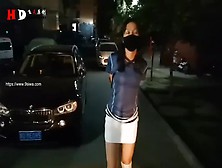 Woman Walks Around Outside In Armbinder