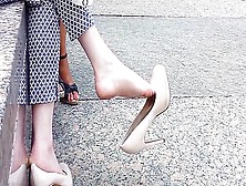 Creme Leather Pumps Dangling In The Air