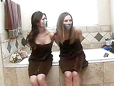 Two Hot Girl Bound Together In Bathroom