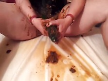 Cucumber In Her Ass While She Smears Poop
