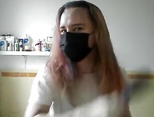 Girl Painting Her Hair In Surgical Mask And Gloves