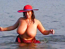 Chubby Cougar With Huge Natural Tits Touching Her Hot Body On The Beach