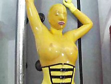 Hot Girl In Latex Glamour Yellow Catsuit Gets To Climax