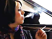 Girl In Scarf Smokes Cigarette
