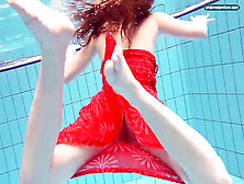 Crimson Clad Teenage Swimming With Her Eyes Opened