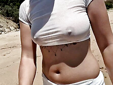 She Walks On The Beach In A Transparent Blouse,  Visible Breasts And Erect Nipples