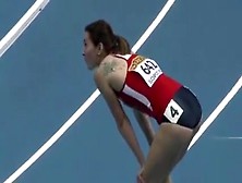 Athletic Woman Runs Around The Track In A Flimsy Outfit