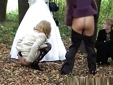 Three Ladies Help Bride Pee Outdoors