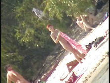 A Horny Voyeur Loves Filming Hot Nudity On The Beach.
