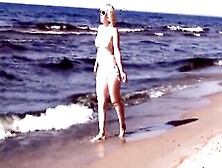 Babe Milf Into A White Bikini On The Beach