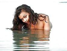The Delicious Naked Body Of The Luxurious Brunette Atena A Relaxing In The Calm Water