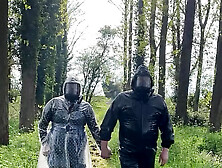 Plastic Raincoat And Gasmask In The Woods