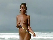 Deeply Tanned Teen Poses For Pictures On The Nudist Beach