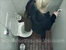 Blonde Girl Using A Public Bathroom