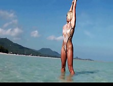 Hot Milf Posing In Wet See Through Bikini On The Beach
