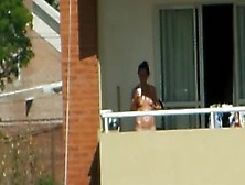 Girl Sunbathing Topples Un Bacony In Argentina.