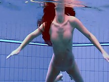 Hot European Brunette Swims Naked In The Pool