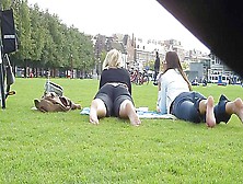 Two Hot Young Unsuspecting Ladies Get Their Cute Bare Feet Filmed On The Grass