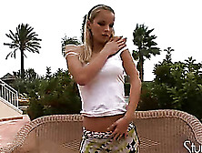 Kinky Blonde Takes Her Skirt Off And Masturbates On The Outdoor Couch
