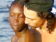 African Girl Sucks Two White Cocks At The Beach