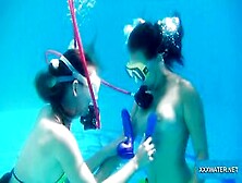 Underwater Lesbians Lick And Suck Dildos