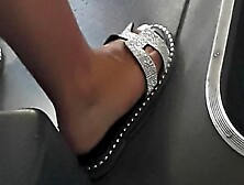 Close-Up View Of Sexy Student's Feet In Silver Sequin Sandals (Faceshot)