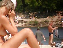 Nudist Babe Talking On The Phone And Sunbathing Her Ass