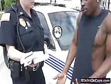 Duo Of Busty Cops Abusing Black Smuggler
