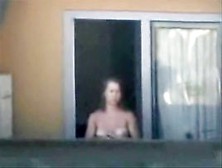 Sexy Neighbor Showing Off Her White Tits In The Window