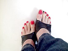 Girl In Jeans Has Her Sexy Amateur Feet With Red Nail Polish On The Camera