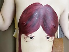 用乳房画一个彩绘人物的头，奶头变成发夹啦