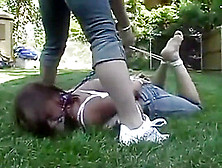 Garden Girl Hogtied,  Gagged And Tickled