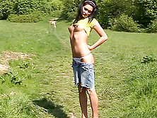 Cutie On A Creekside Stroll Sits In The Grass To Masturbate