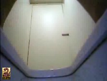 Asian Teacher Using A Public Bathroom