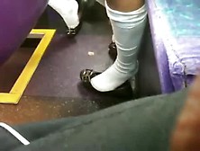 A Pair Of Girls Shoeplay On The Bus