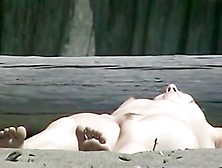 Nudist Woman Shows Her Shaved Slit On The Coast