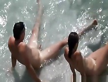 Nudist Couple In The Water