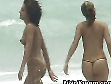 Two Sexy Hotties Enjoy The Waves And Their Tits Shown.