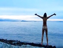 Naked Woman Greets The Beauty Of The Sea
