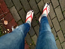 A Crossdresser With Sexy Feet In Flip Flops Is Tempting On The Street