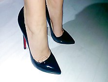 Businesswoman Showing Her Feet And Legs In Expensive Pair Of Black Shoes