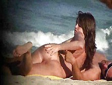 Nudist Couple On A Beach