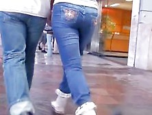Girl In Blue Jeans Walking With Her Boyfriend On The Street