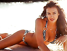 Gorgeous Russian Model In Bikini Poses While Having Collared Cheetah Beside Her.