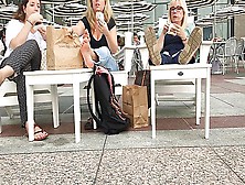 Three Female Strangers Reveal Their Feet While Eating At The Restaurant Outdoors